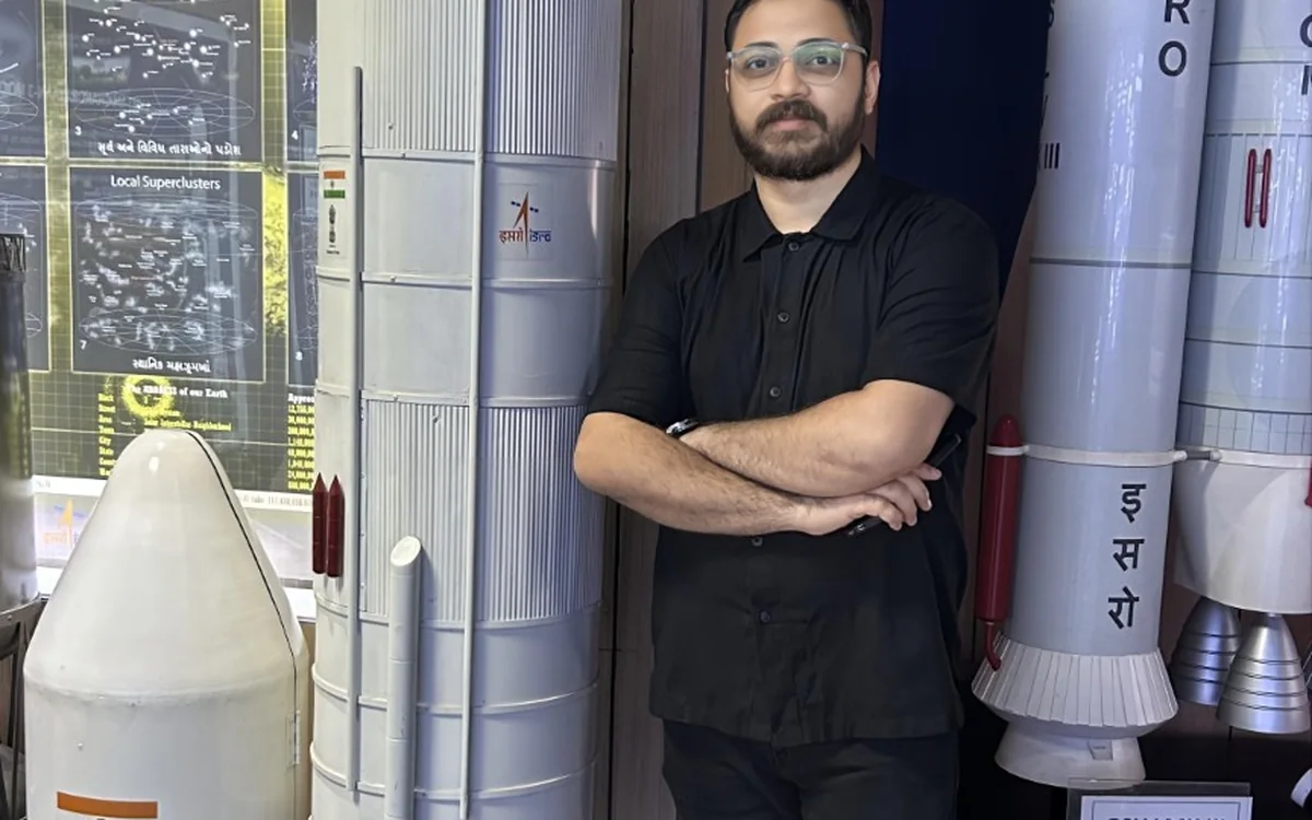 Sarvesh Bhardwaj beside Indian launch vehicle models