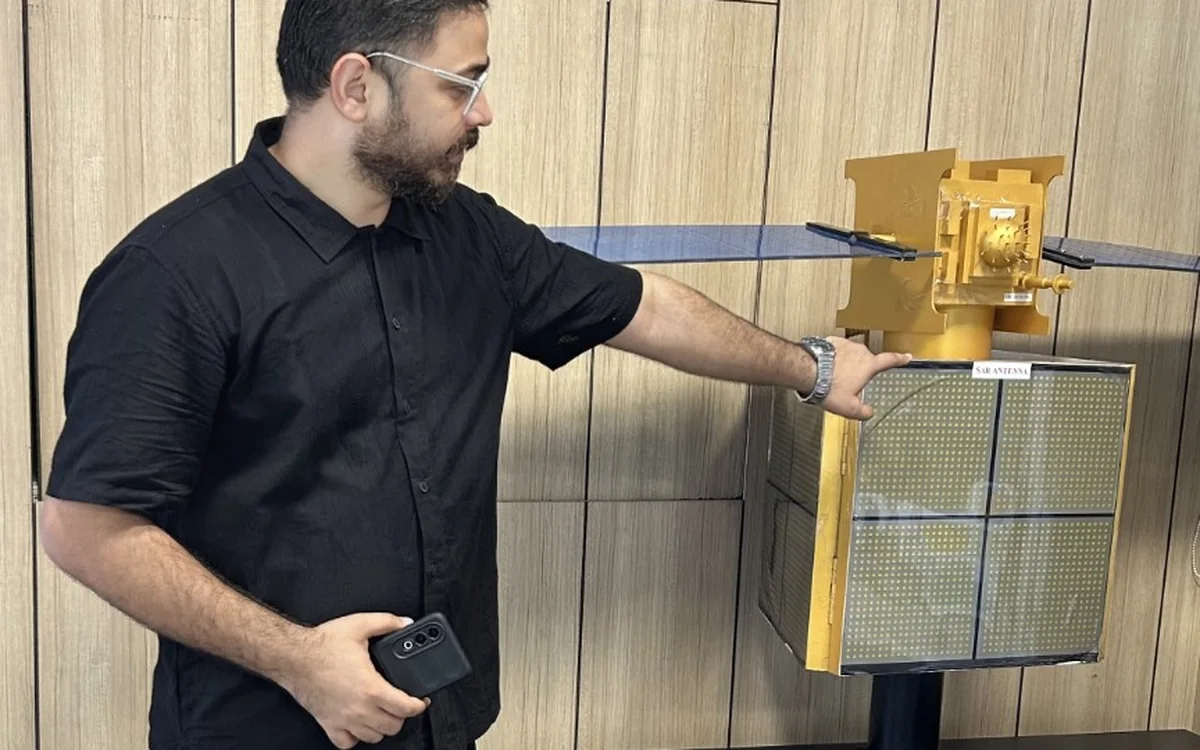 Sarvesh Bhardwaj with a satellite model